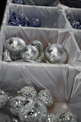 Christmas balls in a box. Silver glass balls and blue bulbs in boxes at Christmas market in Berlin Germany. Fairytale Christmas tree ornaments. Holiday decor. Christmas decorations. Celebrate New Year