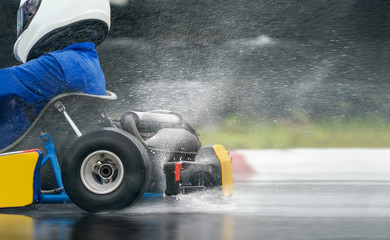 Go Kart increase speed with rain tire in race track - obrazy, fototapety, plakaty