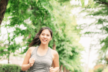 woman runner running outdoor in a park for health