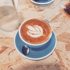 cup of coffee on wooden table
