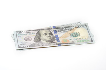 Two hundred dollars in hundred-dollar bills life on a white background.