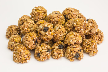 heap of granola cereal bites with quinoa and dried blueberries