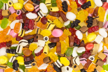 background of colorful gummy candy and licorice