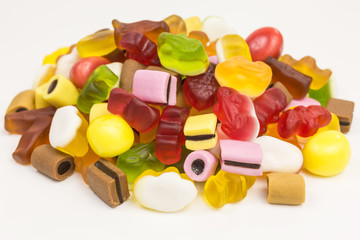 heap of colorful gummy candy and licorice