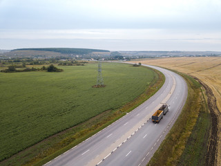 Aerial Top View of Truck with Cargo Semi Trailer Moving on Road in Direction