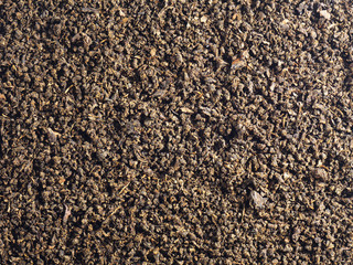 Fermented granulated tea from Cherry (Cerasus) leaves as a background