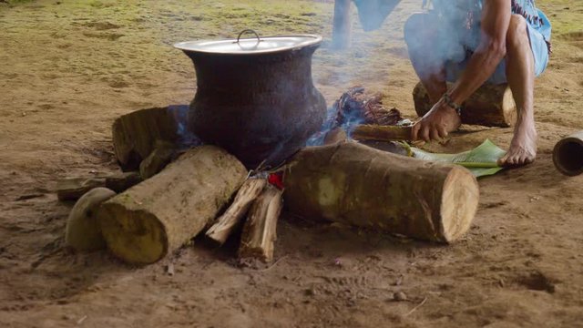 Amazonian Indigenous Chief Crushing Ayahuasca Sticks In Ecuador