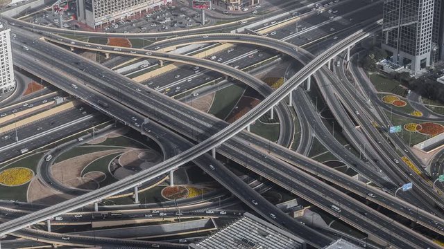 Aerial view of famous highway intersection at daytime. 4K time lapse. Dubai, UAE.