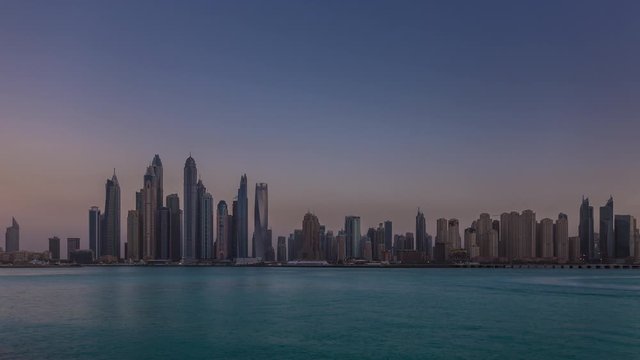 Scenic view of Dubai Marina Skyscrapers, night skyline, View from Palm Jumeirah, United Arab Emirates. Time lapse.