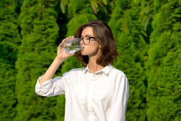 Fototapeta premium Girl drinks water.