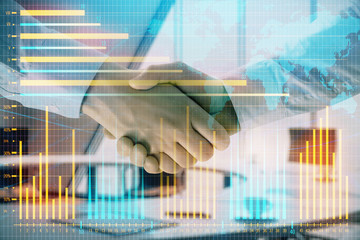 Multi exposure of financial chart and map on office background with two businessmen handshake. Concept of success in business