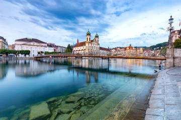 Lucerne. Old city embankment and medieval houses at dawn.