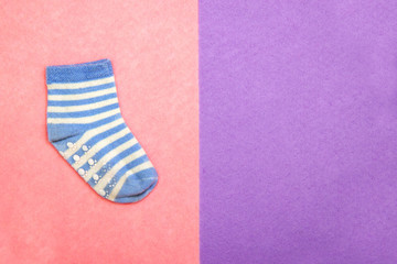 Sock for child. Top view.blue striped socks on pink, violet backgrounds. Abstract seamless texture in the style of pop art with copy spase for text
