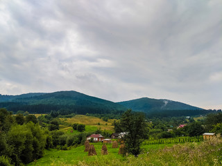 Fototapeta na wymiar Carpathian hills during the rain with dramatic clouds