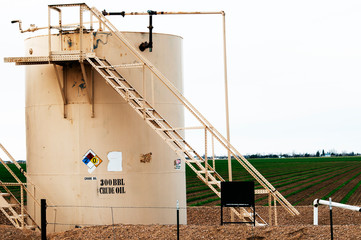 Crude oil tank on farmland