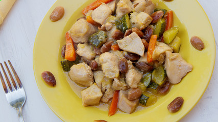 Chicken dish from a restaurant.  Chicken with almonds.