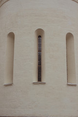 narrow windows in the church with bars, building element, historical object