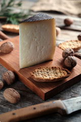 Cured cheese with rustic background