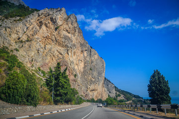 Fototapeta na wymiar Russian asphalt roads. Background road. Roads in the mountains of Crimea. Travel by car. Road views.
