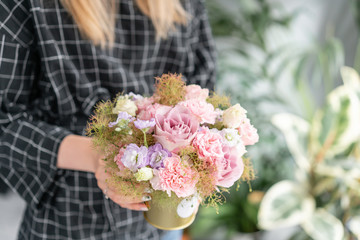 Beautiful bouquet of mixed flowers in woman hand. Floral shop concept . Handsome fresh bouquet. Flowers delivery.