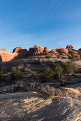 Sunset and Moon add to the drama of the landscape in the Needles District of Utah which is part of the Canyonlands National Park.