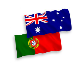 National vector fabric wave flags of Australia and Portugal isolated on white background. 1 to 2 proportion.