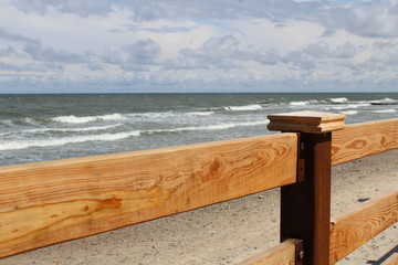 wooden railing and sea