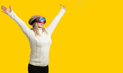 Woman Skier Standing at Snow Looking . Winter yellow, orange, background