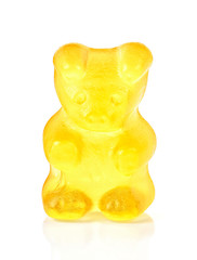 Yellow fruit gummy candy in the form of a bear. Jelly bean.
