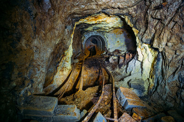 Collapsed old abandoned ruined mine tunnel