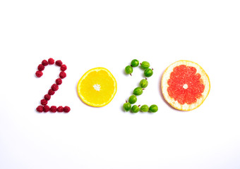 New year 2020 made of fruit and berries on the white background.