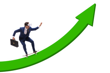 Fototapeta premium Businessman riding skateboard on financial graph