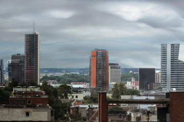 City landscape before thunderstorm with gray clouds