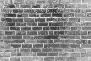 Black and white brick wall background with natural white vignette