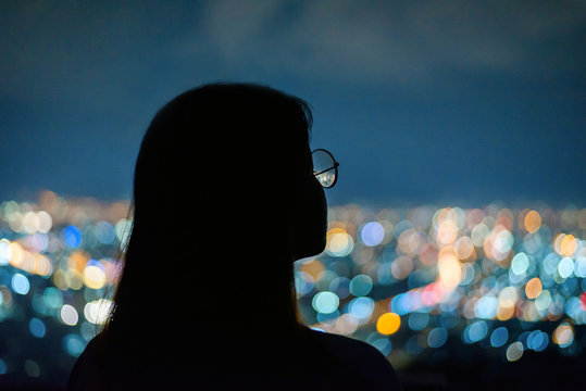 Silhouette Woman Portrait  In City Night Light Bokeh Background , Chiang Mai ,Thailand