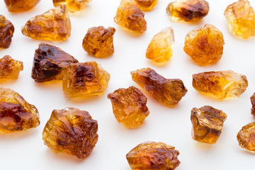 Brown caramelized sugar on white background.
