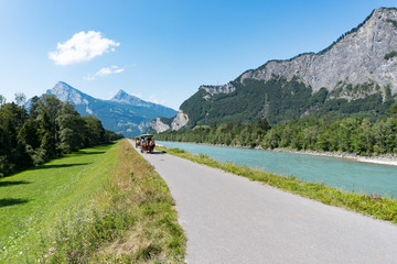 horse and carriage sightseeing tour along the Rhine River in the Swiss Alps