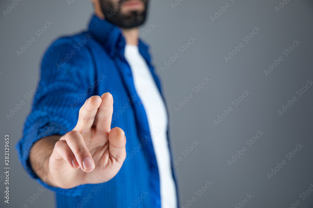 Poster man empty palm on dark background