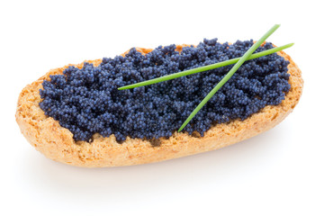 Canapes with black sturgeon caviar and  spice isolated on the white background.