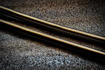 Metallic spring on a dark background