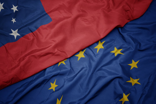 waving colorful flag of european union and flag of Samoa.