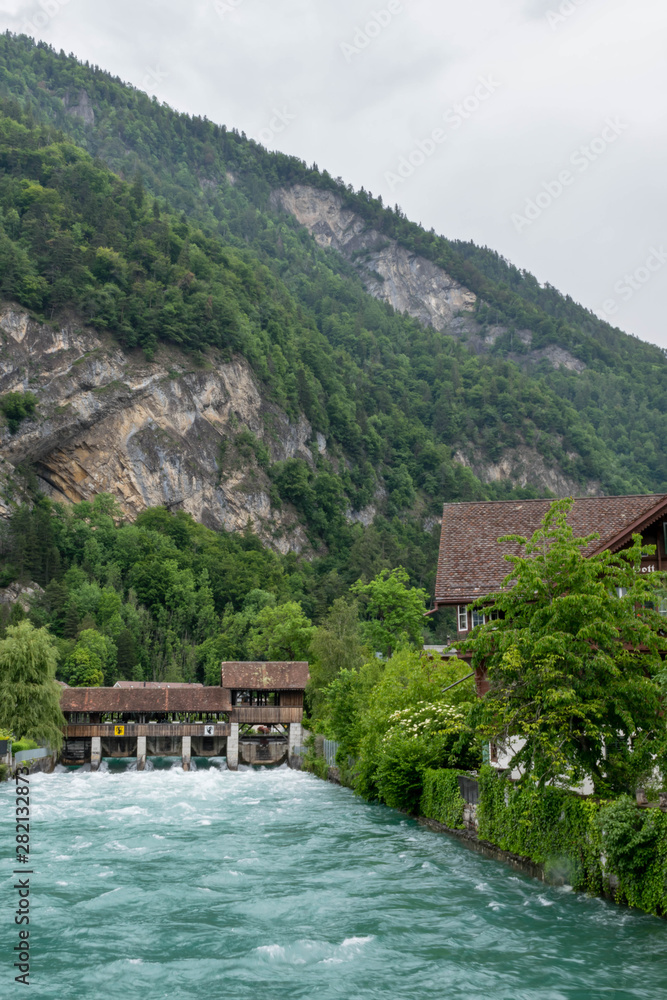 Wall mural Aare river and bridge through it, Switzerland