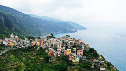 Aerial view of Corniglia village on rocky coast, Cinque Terre, Italy.