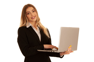 Young business woman works on laptop isolated over white