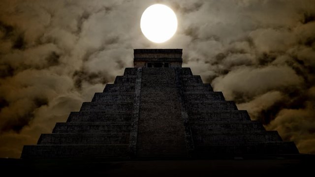 Mexico: Mayan Pyramid by Night, Time Lapse with Full Moon, Bright Clouds and Dark Kukulcan Temple in Silhouette, Chichen Itza