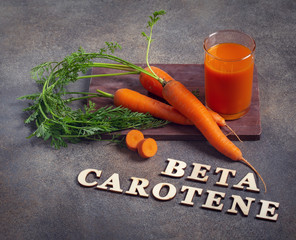 Beta carotene text and carrot juice - obrazy, fototapety, plakaty