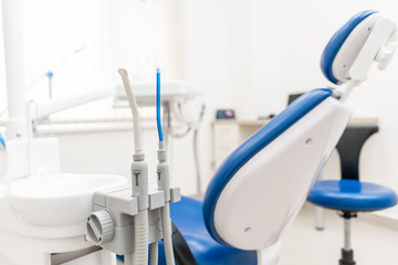 Close-up dentist saliva ejector. Dental work in clinic. Operation, tooth replacement. Medicine,...