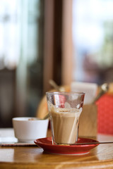 Large cup of coffee latte on a table