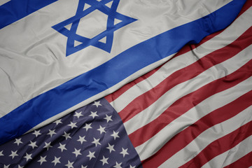 waving colorful flag of united states of america and national flag of israel.