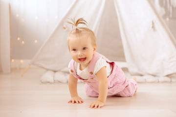 baby girl playing in the nursery, baby learning to walk, textiles for the nursery., tent in the children's room